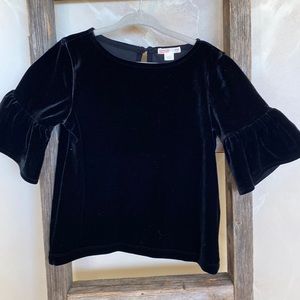 Crew cuts. Black velour top with loose ruffle sleeve